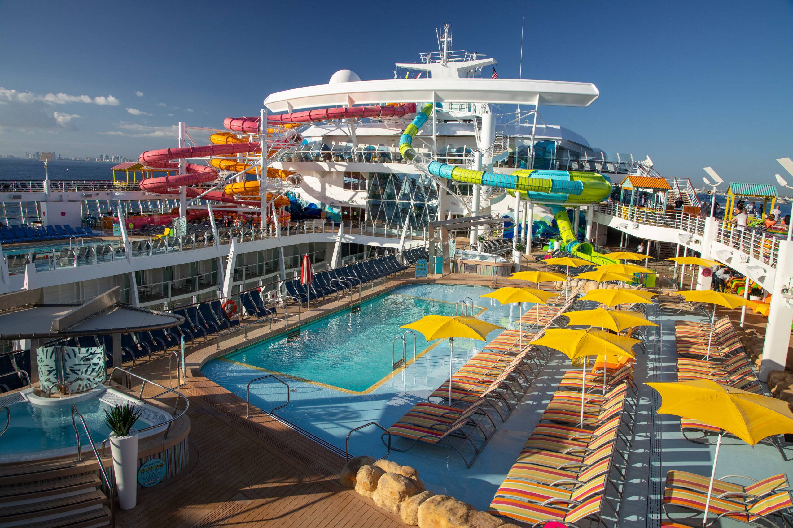 Luxury cruise ship with water slides and pool deck